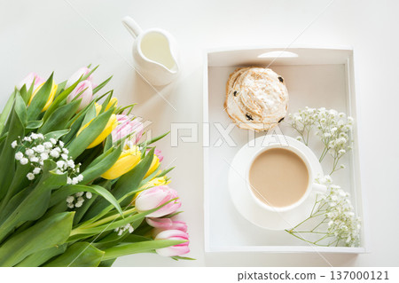 Spring morning breakfast, coffee, milk jug and cake with decor of pink hyacinth. Spring morning breakfast, coffee, milk jug and cake with decor of pink hyacinth. 137000121