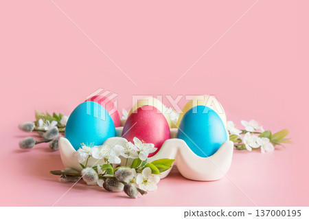 Colorful eggs with spring flowers in porcelain box. Easter. Spring. Close up. 137000195