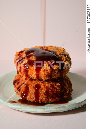 Pour sauce over the croquettes 137002183