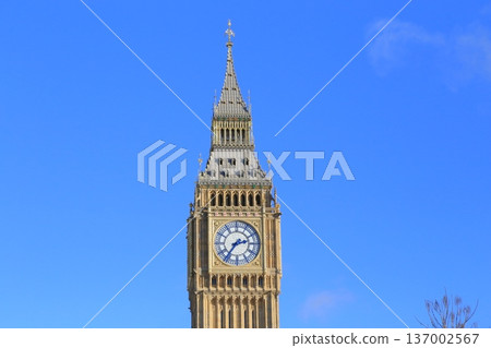 Big Ben, the symbol of London against the blue sky Big Ben, the symbol of London against the blue sky 137002567