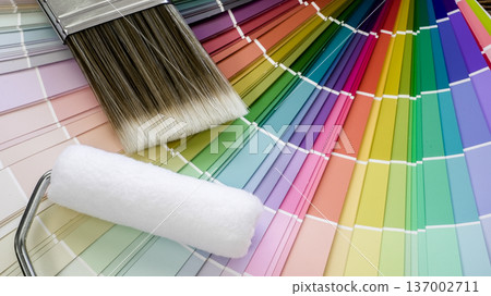 Paint brush and roller on colorful color swatches Paint brush and roller on colorful color swatches 137002711