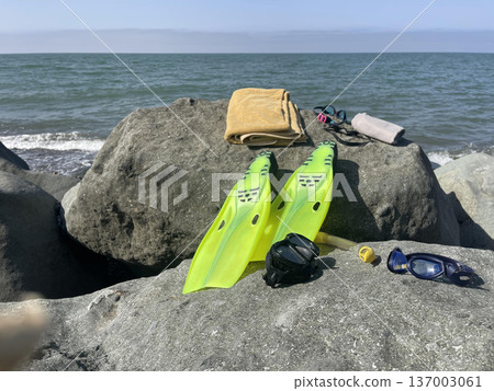 diving equipment lies on a rock near the beach diving equipment lies on a rock near the beach 137003061