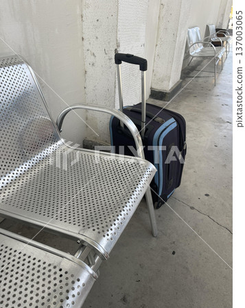 a suitcase on the rail station 137003065