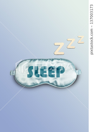 Flat lay of blue sleeping mask with letters Z symbolizing deep sleep. World sleep day. Vertical Flat lay of blue sleeping mask with letters Z symbolizing deep sleep. World sleep day. Vertical 137003173