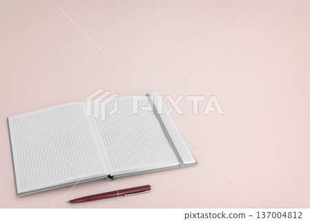 Open notebook with pen on pink background Open notebook with pen on pink background 137004812