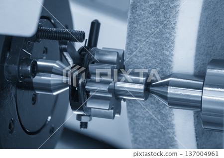 High-precision cylindrical grinding process for surface finishing of automotive transmission gears in an advanced industrial setting. High-precision cylindrical grinding process for surface finishing of automotive transmission gears in an advanced industrial setting. 137004961