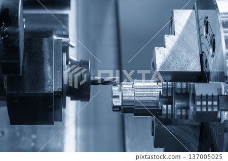 The CNC mill turn center performing a milling operation. 137005025