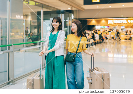 Two women moving around the airport (Photo courtesy of Kansai International Airport (KIX)) Two women moving around the airport (Photo courtesy of Kansai International Airport (KIX)) 137005079