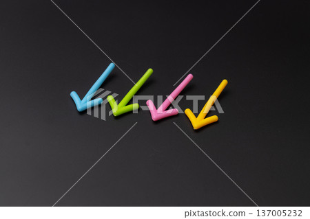 Stock photo of a black background and a downward arrow - Down image Stock photo of a black background and a downward arrow - Down image 137005232
