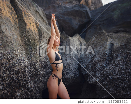 Young woman enjoying serene evening at sea in Krabi, Thailand Young woman enjoying serene evening at sea in Krabi, Thailand 137005311