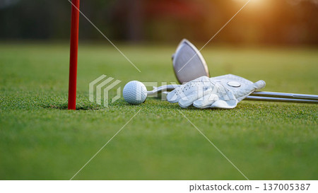 Close up of golf equipment on green grass. 137005387
