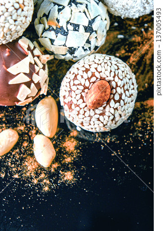 Candy, top view. Assorted chocolates on a dark background. Candy, top view. Assorted chocolates on a dark background. 137005493