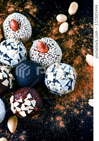 Candy, top view. Assorted chocolates on a dark background. Candy, top view. Assorted chocolates on a dark background. 137005494