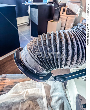 Workplace in a professional beauty salon. Fume and dust extractor for manicure or cosmetic procedures. Workplace in a professional beauty salon. Fume and dust extractor for manicure or cosmetic procedures. 137005637