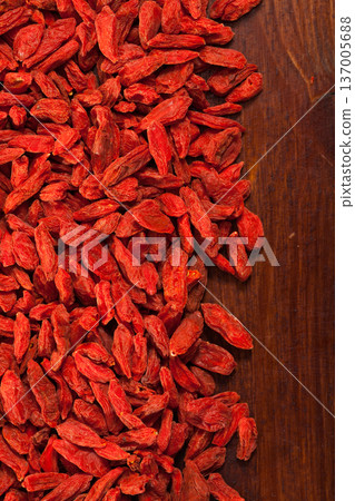 Goji berries on dark wooden surface Goji berries on dark wooden surface 137005688