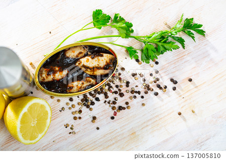 Chipirones in ink with parsley, lemon and spices Chipirones in ink with parsley, lemon and spices 137005810