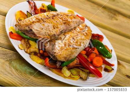 Baked spanish mackerel and different vegetables at plate, bulgarian cuisine 137005833
