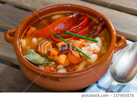 Soup of bean with boiled carrots, pepper and greens, served in bowl Soup of bean with boiled carrots, pepper and greens, served in bowl 137005878