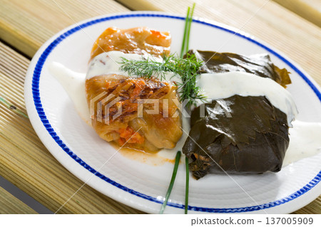 Stuffed cabbage and grape leaves Stuffed cabbage and grape leaves 137005909