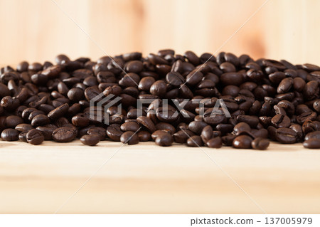 Image of fresh coffee beans on natural wooden background Image of fresh coffee beans on natural wooden background 137005979