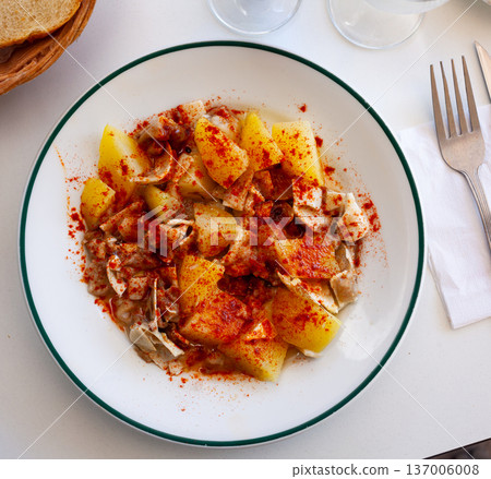 Galician dish of stewed pigs ear with pepper and potatoes Galician dish of stewed pigs ear with pepper and potatoes 137006008