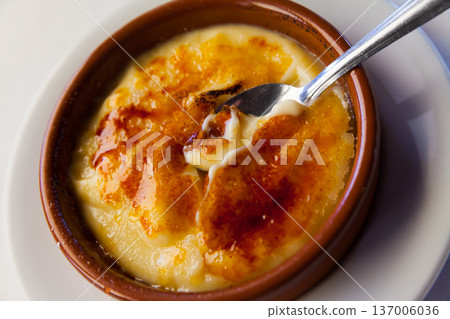 Tasty dessert catalana crema served with caramel crust, nobody Tasty dessert catalana crema served with caramel crust, nobody 137006036