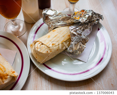 Shawarma with chopped vegetables and greens 137006043