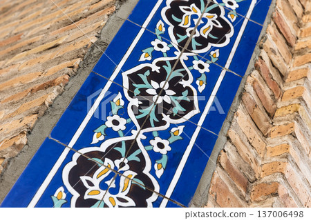Close-up of a blue ceramic tile border of a Mosque wall Close-up of a blue ceramic tile border of a Mosque wall 137006498