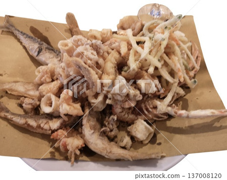 Classic fried mixed seafood dish served on paper 137008120