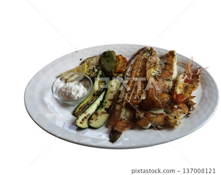 Grilled fish and prawns with roasted vegetables plate 137008121