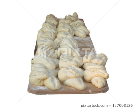 Raw bread dough resting on wooden board 137008126