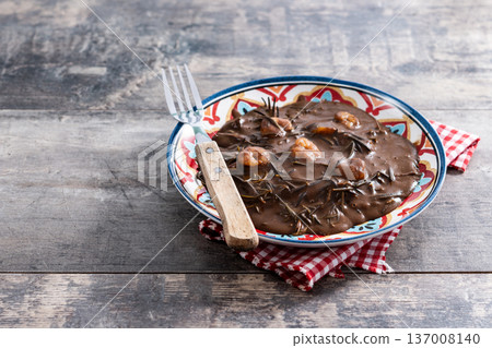 Mexican romeritos with mole sauce and shrimp Mexican romeritos with mole sauce and shrimp 137008140