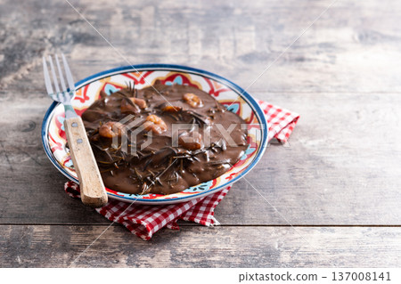 Mexican romeritos with mole sauce and shrimp 137008141