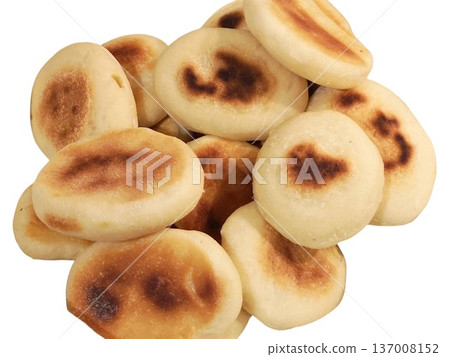 Pile of golden brown traditional fried corn cakes Pile of golden brown traditional fried corn cakes 137008152
