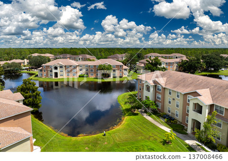 New apartment condos in Florida suburban area. Family housing in quiet neighborhood. Real estate development in American suburbs New apartment condos in Florida suburban area. Family housing in quiet neighborhood. Real estate development in American suburbs 137008466