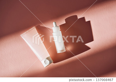 Skincare cosmetic tube and serum bottle with shadows Skincare cosmetic tube and serum bottle with shadows 137008467