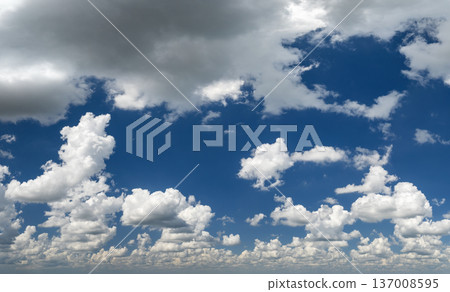 Bright landscape of blue sky with flying white clouds. Colorful summer skyscape 137008595