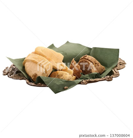 Bread slices arranging on green napkin in tray 137008604