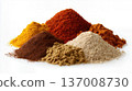 Colorful assortment of powdered spices arranged in piles on white background, food seasoning and culinary concept. 137008730