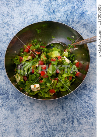Salad of Iceberg Lettuce with Tomatoes, Olives, White Salad Cheese, Garlic and Olive Oil . 137009009