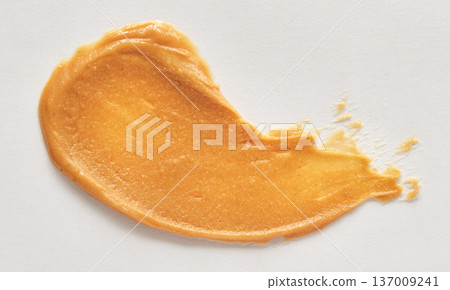 Smooth Golden Peanut Butter Spread On White Surface For Culinary And Texture Concepts 137009241