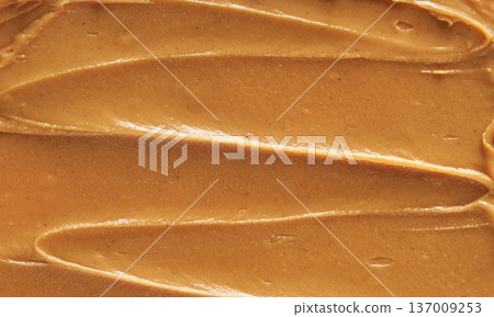 Smooth Creamy Peanut Butter Texture With Swirled Pattern For Food Background And Culinary Design Smooth Creamy Peanut Butter Texture With Swirled Pattern For Food Background And Culinary Design 137009253