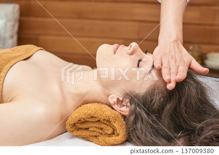 Caucasian Female Adult Receiving Relaxing Head Massage At Spa For Wellness And Stress Relief 137009380