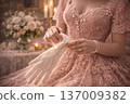 Close-up of Woman in Ornate Pink Gown Putting on Silk Gloves 137009382