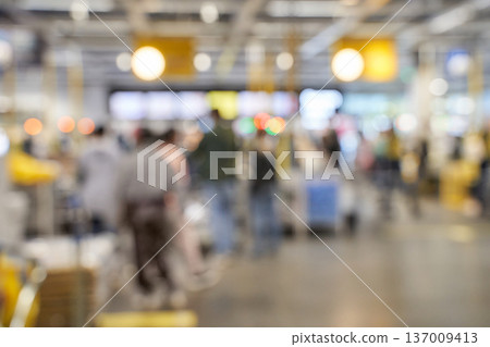 Blurred crowd in busy shopping mall with diverse adults and teens engaged in shopping activities Blurred crowd in busy shopping mall with diverse adults and teens engaged in shopping activities 137009413
