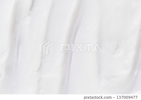 Smooth white cream texture with subtle swirls for skincare background design or cosmetic product Smooth white cream texture with subtle swirls for skincare background design or cosmetic product 137009477