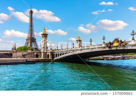 Eiffel Tower behind the Alexandre III Bridge, view from the Seine River, Paris, France 137009801