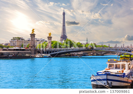 Paris sunset view with Eiffel Tower and Alexandre III Bridge over river Seine, France Paris sunset view with Eiffel Tower and Alexandre III Bridge over river Seine, France 137009861