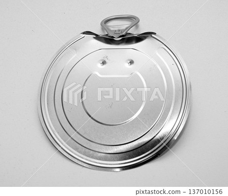 Open metal can lid on white background 137010156