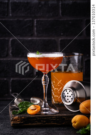 Fresh apricot cocktail martini with mint 137010314